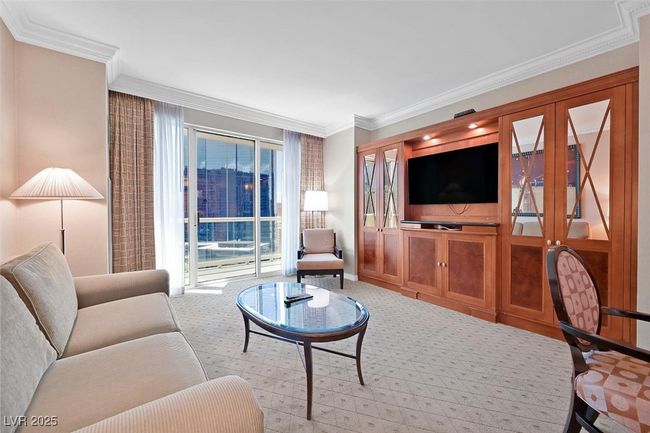 Living area with light carpet and ornamental molding | Image 11