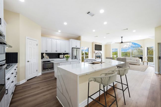 Private kitchen and large den w/bar alcove | Image 9