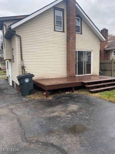 View of side of property featuring a wooden deck | Image 3