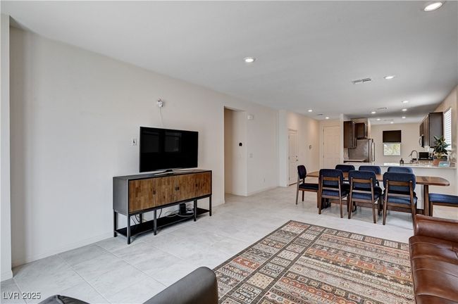 Living room featuring light tile patterned flooring and recessed lighting | Image 8