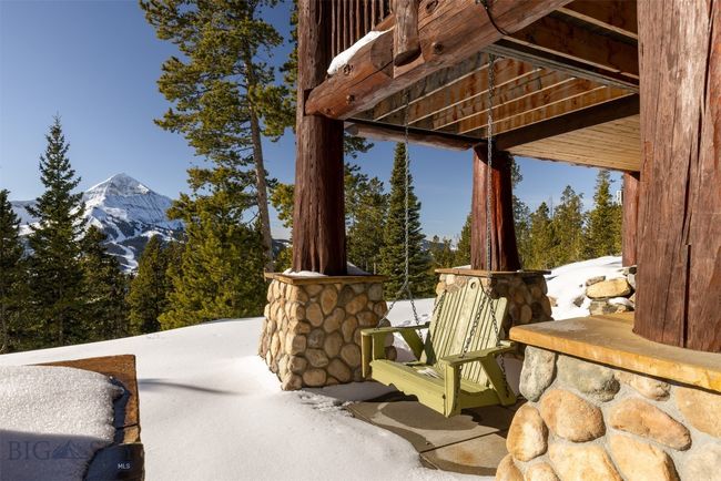 Entry/garage level patio with chair swing and Lone Mountain views. | Image 68