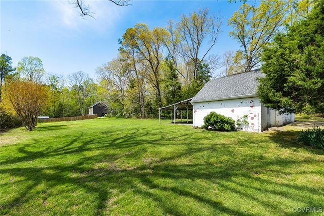 View of yard with an outbuilding | Image 29