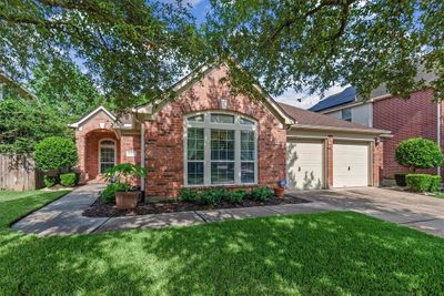 Charming 1-story with 2 car attached garage and double wide driveway located in the master-planned community of Fall Creek. | Image 1