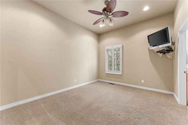 Empty room featuring baseboards, visible vents, ceiling fan, and light colored carpet | Image 45