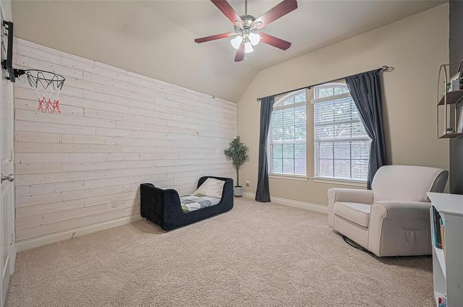 Upstairs, you’ll find three additionalbedrooms. Each bedroom is thoughtfullyappointed with plush carpeting, aspacious closet, and picture windowsthat fill the rooms with natural light. | Image 33
