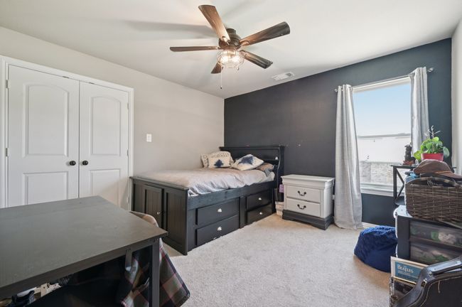 Third bedroom featuring a ceiling fan and a closet | Image 16