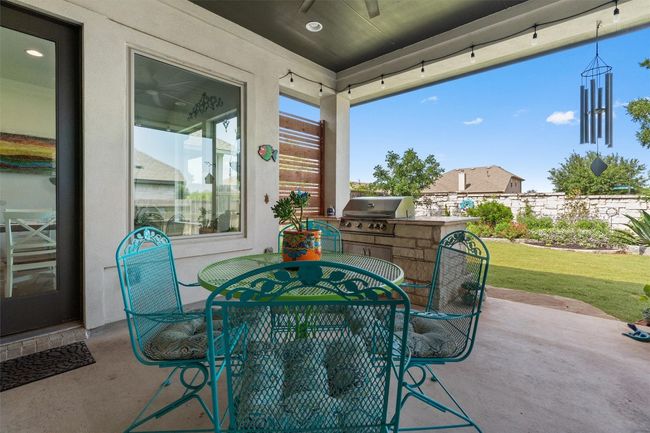 View of patio featuring outdoor dining space and a ceiling fan | Image 28