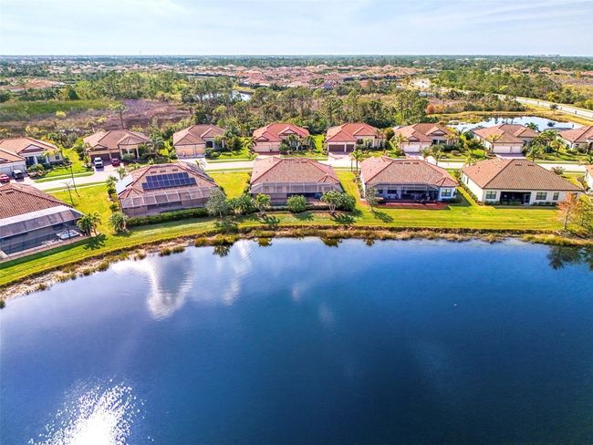 Aerial View of Heated Pool & Spa Overlooking the Large Lake | Image 65