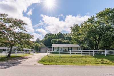 View of front facade with an outbuilding and a front lawn | Image 3