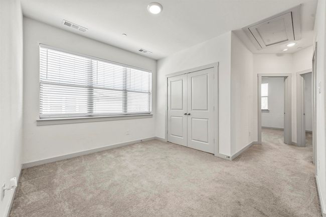 Unfurnished bedroom featuring light colored carpet and a closet | Image 33