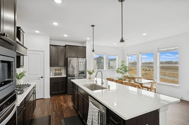 The large center island provide more than enough work space and can be a breakfast bar as well. | Image 9