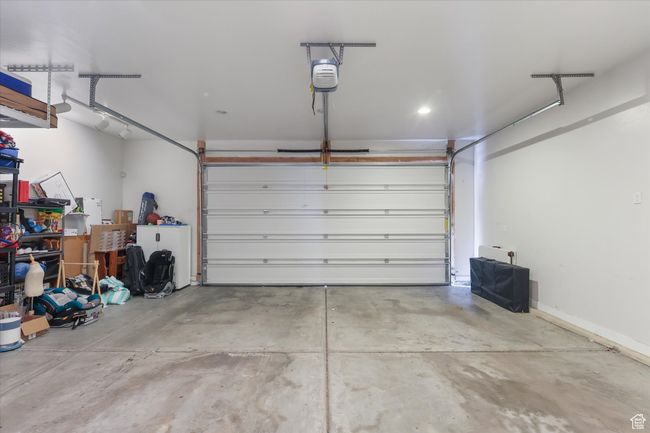 Garage featuring a garage door opener | Image 23