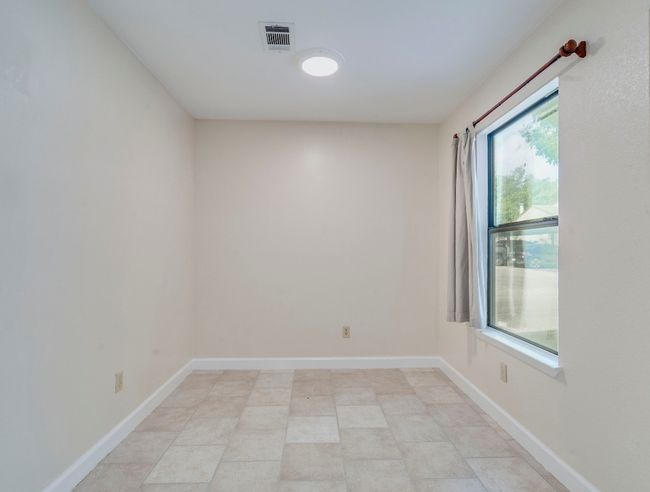 Spare room with baseboards | Image 9