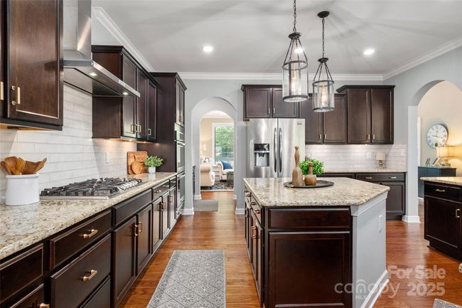 Beautiful kitchen with wood floors and granite counter tops | Image 14