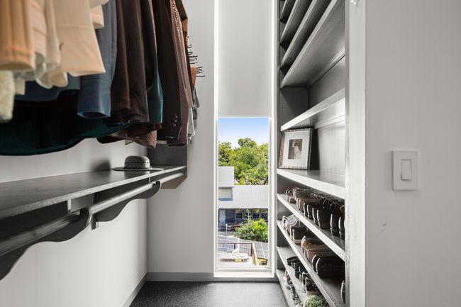 Primary closet with floor to ceiling windows- but added custom shades to control the light and privacy. | Image 20