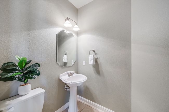Half bathroom featuring toilet and tile patterned floors | Image 18