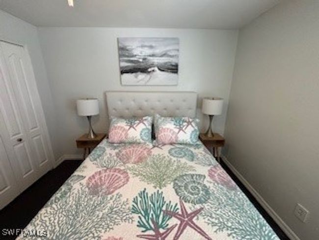 Bedroom with a closet and baseboards | Image 19