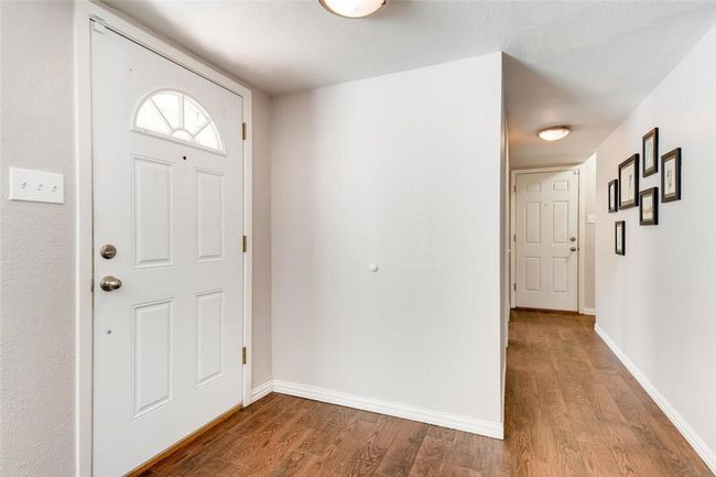 Foyer with wood finished floors and baseboards | Image 22
