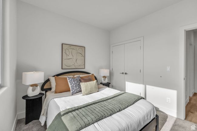 Carpeted bedroom featuring a closet | Image 24