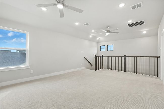Upstairs Bonus room featuring a ceiling fan, light carpet, and recessed lighting | Image 12