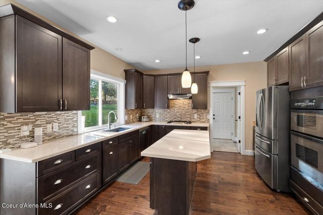 Spacious kitchen with quartz countertops | Image 10