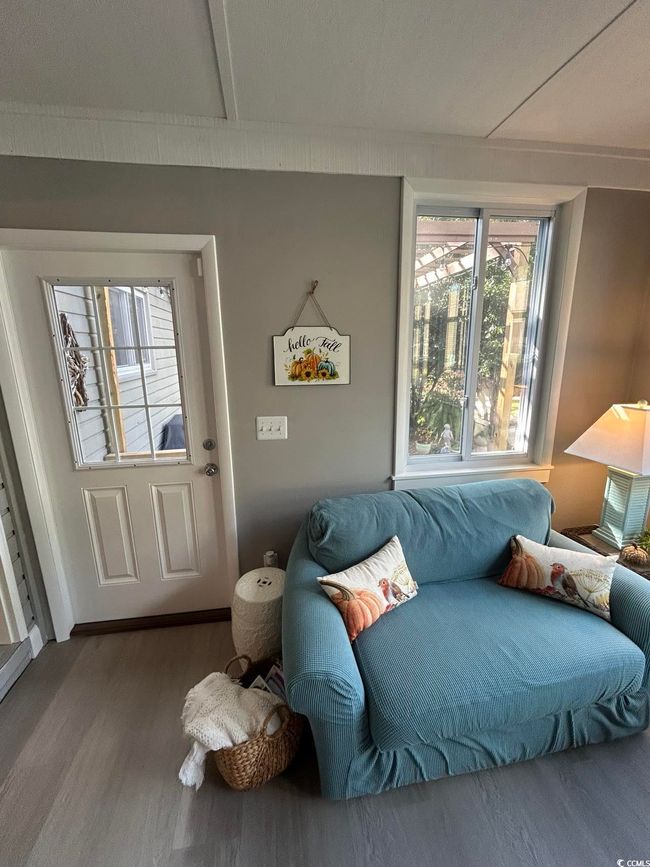 Living area with wood finished floors | Image 14
