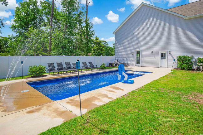 View of pool with a patio | Image 33