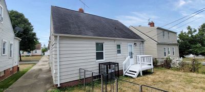 Back of house featuring a lawn | Image 2