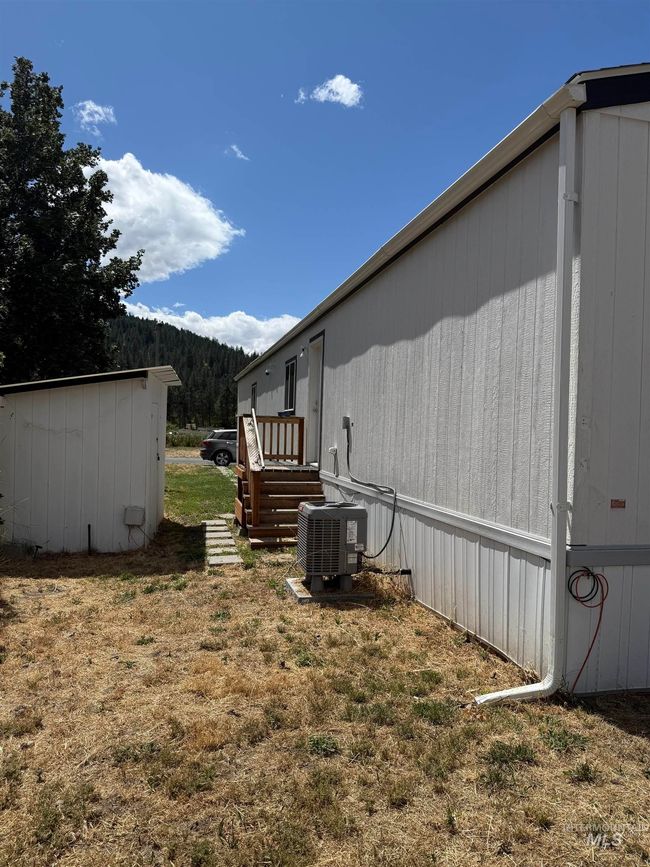 View of lawn with a shed and central air unit | Image 22