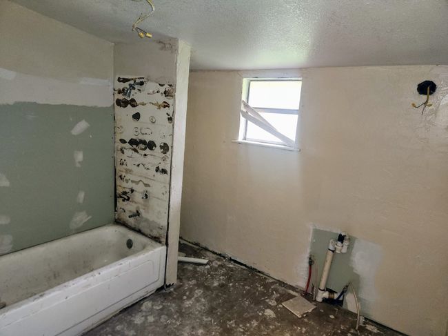 Full bathroom with a textured ceiling | Image 4