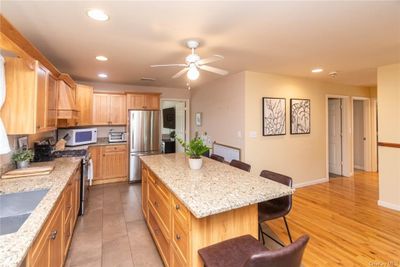 Kitchen featuring a center island. | Image 2