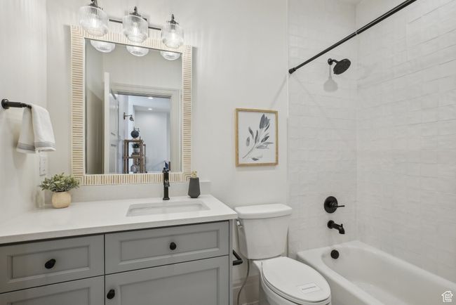 Full bath with shower combination, a closet, vanity, and toilet | Image 31