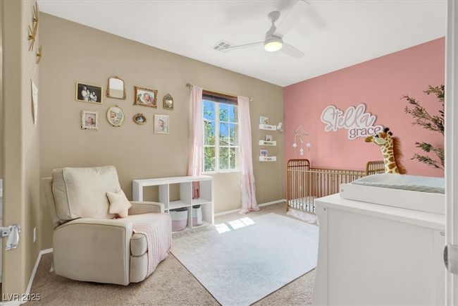 Bedroom with light carpet, baseboards, and a ceiling fan | Image 17