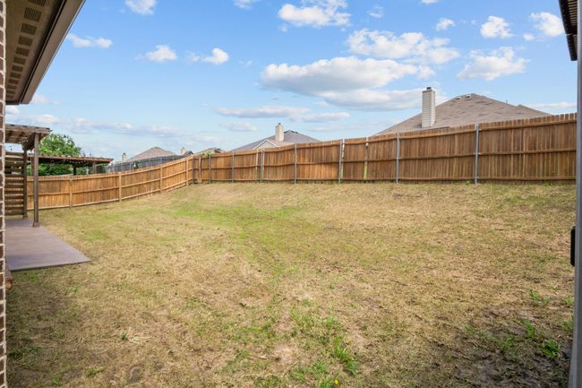 View of yard with a fenced backyard | Image 30