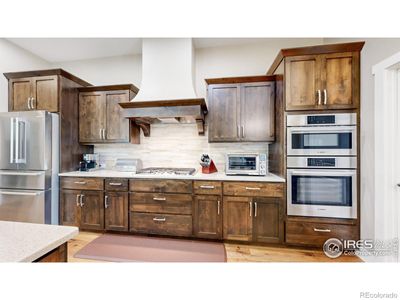 Stainless appliances, gas cooktop & spacious pantry | Image 3