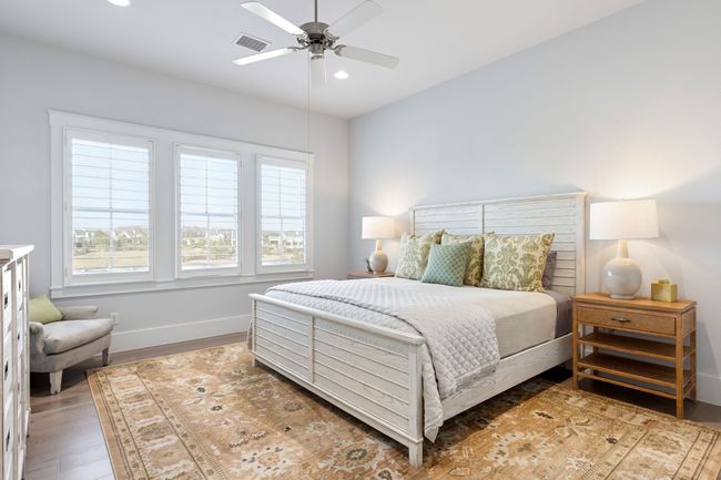 Bedroom with light wood-style flooring, visible vents, baseboards, recessed lighting, and a ceiling fan | Image 20