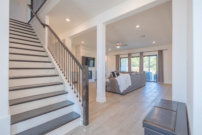 High ceilings, tile flooring, and lots of recessed lighting that illuminates each area of the home. | Image 5
