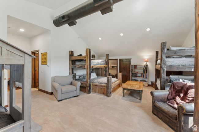 Bedroom featuring light carpet, lofted ceiling, and recessed lighting | Image 34
