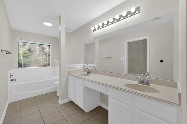 Primary Bath with double sinks, vanity, and soaking tub. | Image 26