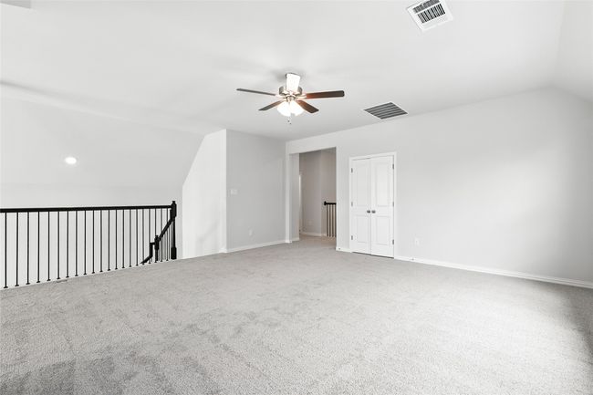 Bonus room featuring vaulted ceiling, a ceiling fan, carpet flooring, and recessed lighting | Image 22