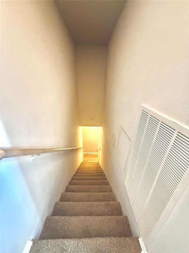 Staircase featuring a heating unit | Image 12