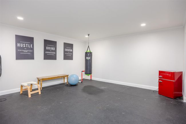 Exercise room with crown molding and recessed lighting | Image 32