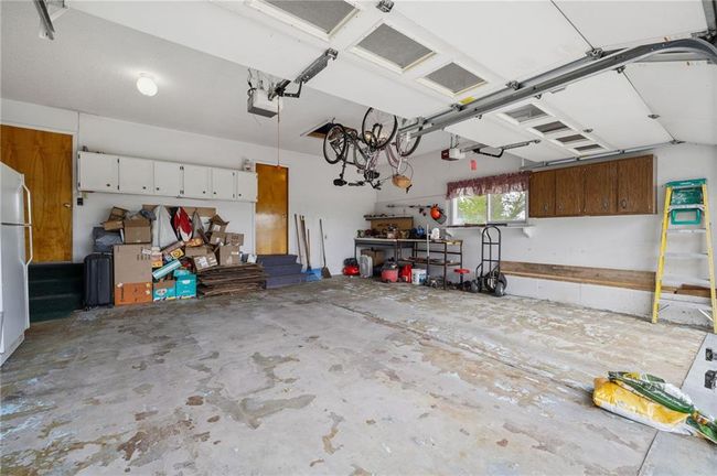 Garage with bonus pantry room | Image 36
