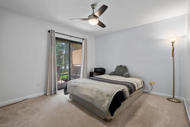 Bedroom featuring carpet floors, a ceiling fan, and baseboards | Image 10