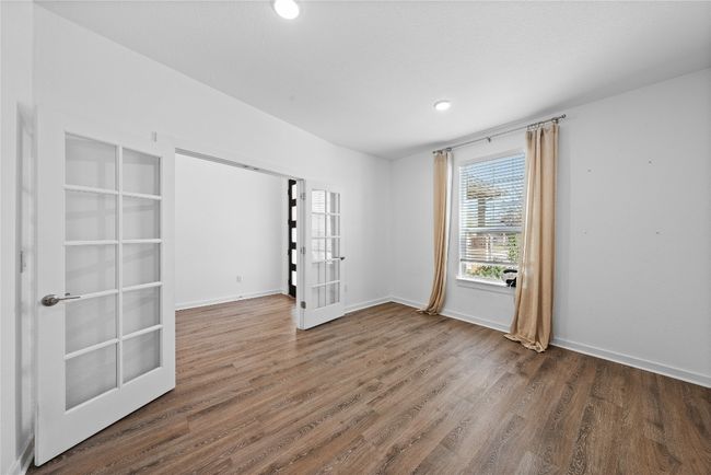 Unfurnished room featuring french doors, baseboards, and wood finished floors | Image 8