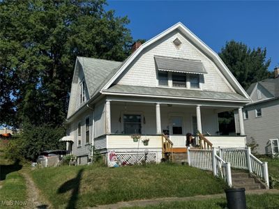 View of front of property featuring a front yard and a porch | Image 1