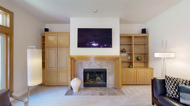 Family room features fireplace & built-ins | Image 8