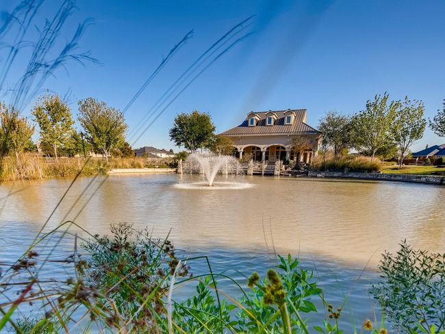 Miles of lakes and walking trails make exploring right out your front door easy. This is one of two clubhouses available for resident use. | Image 35