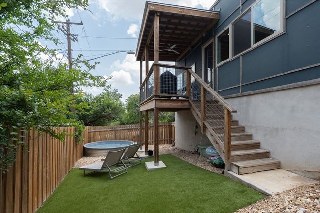Fenced backyard with stairway | Image 36