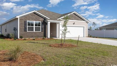 View of front of property featuring a garage and a front lawn | Image 3